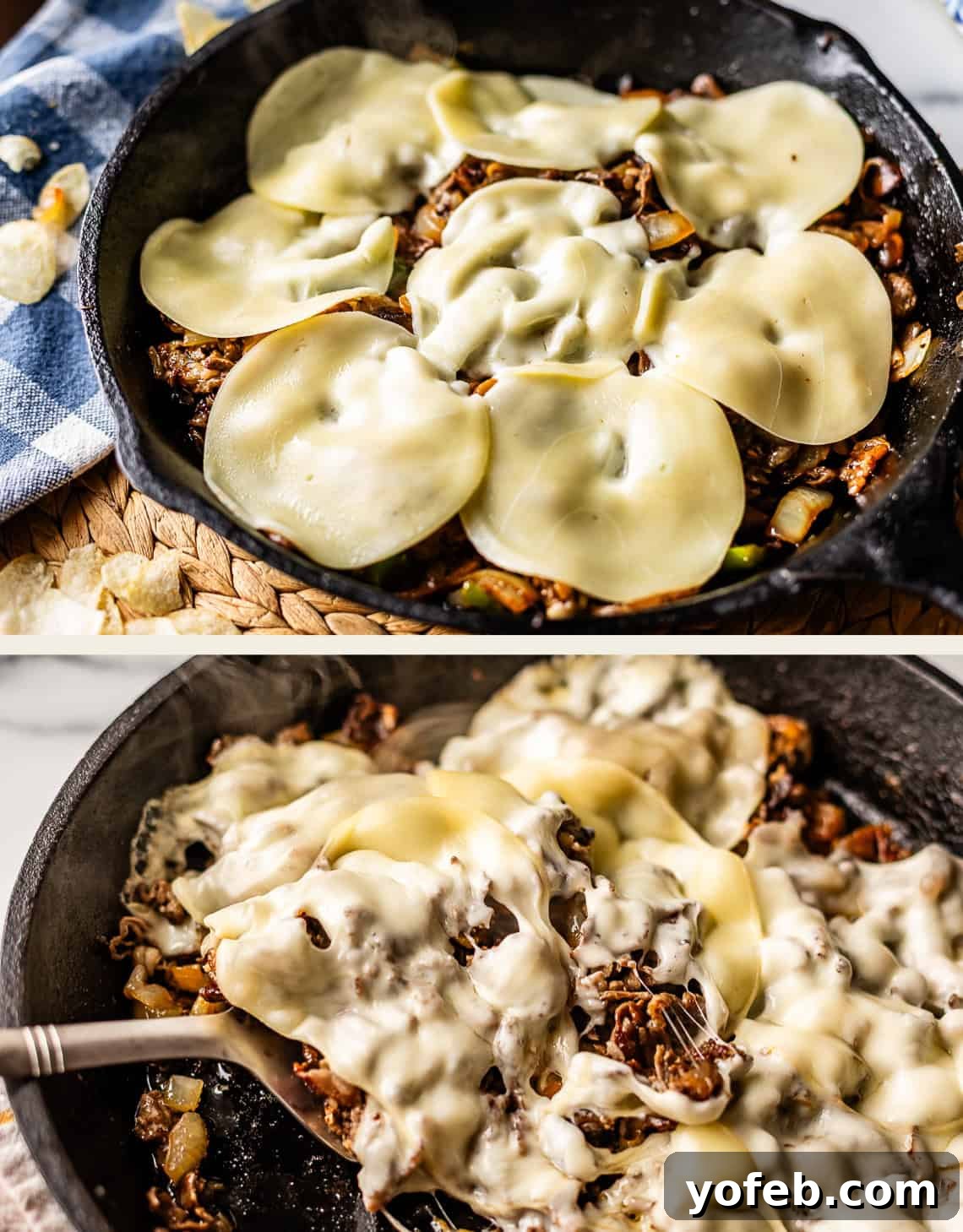 Authentic Philly Cheesesteak Recipe: How to Make It at Home 13 A cast iron skillet with cooked beef, onions, and peppers, topped with melted provolone cheese. In the second image, a serving is being scooped out with a spatula, showing the cheesy, gooey texture.